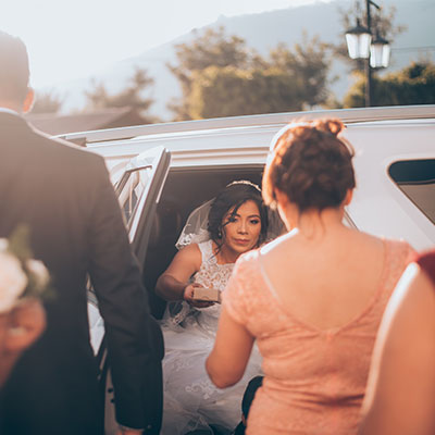 bride in a cadillac escalade wedding limo