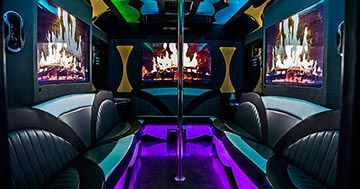 bus liunge with plasma TVs and couches